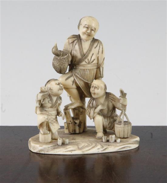 A Japanese carved ivory okimono group of street vendors, Meiji period,(-)